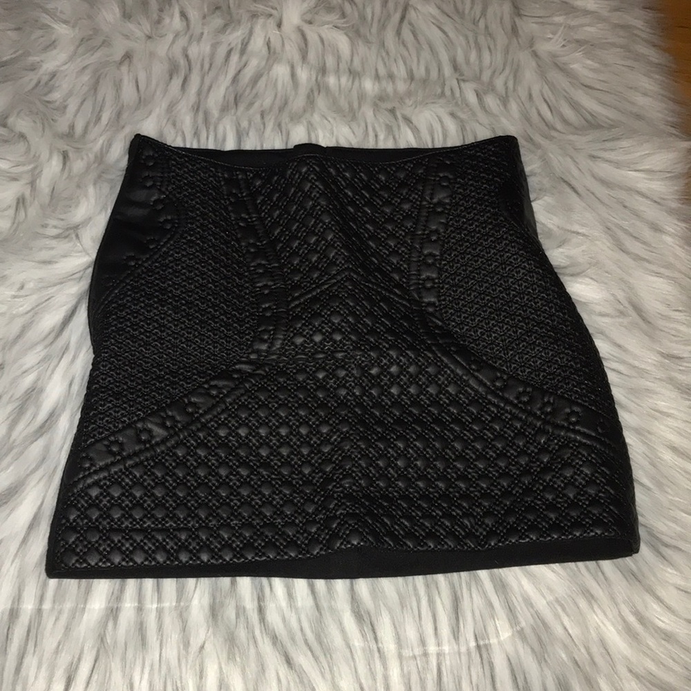 Quilted black leather skirt front